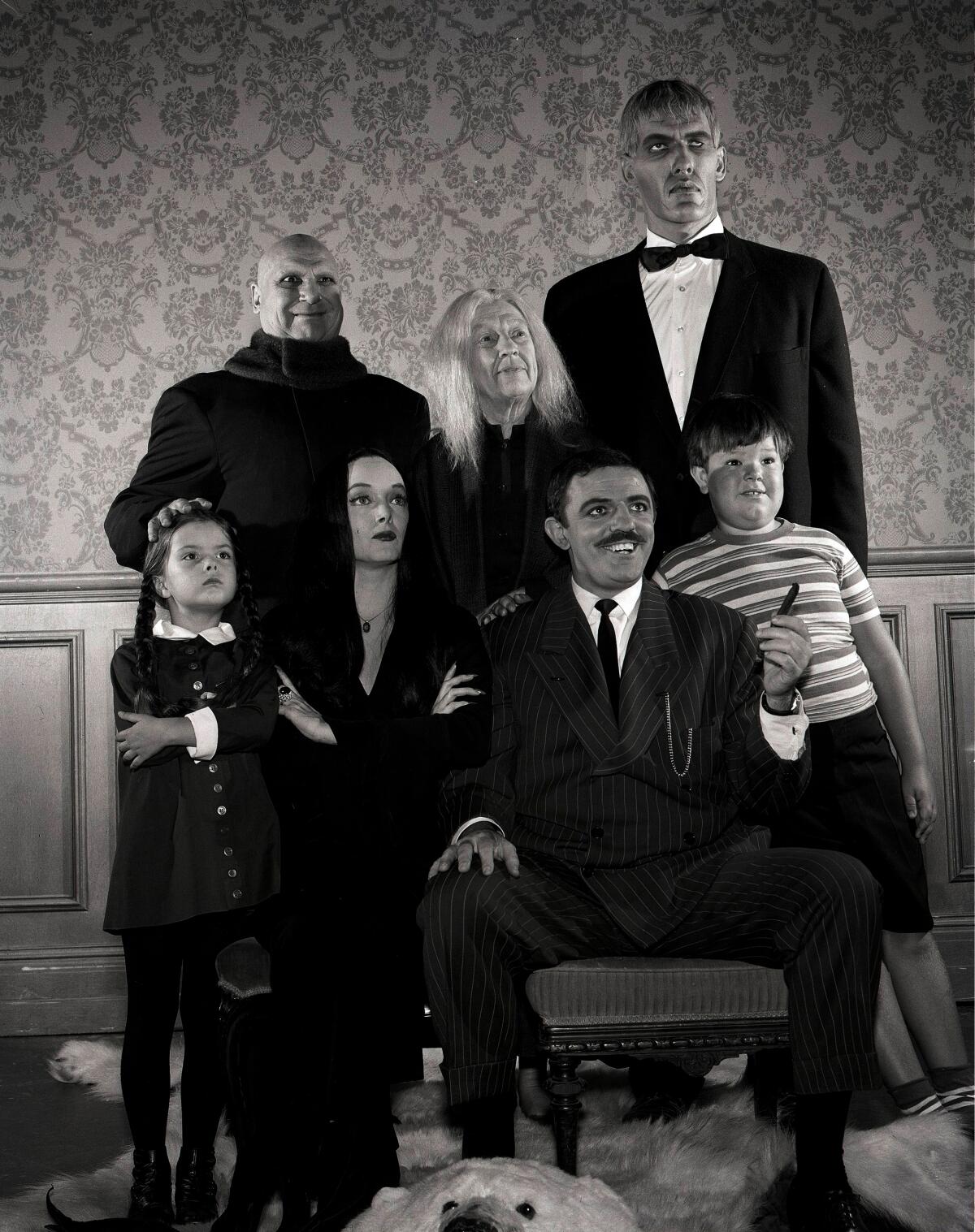 A black and white image of the title family in the 1960s sitcom "The Addams Family."