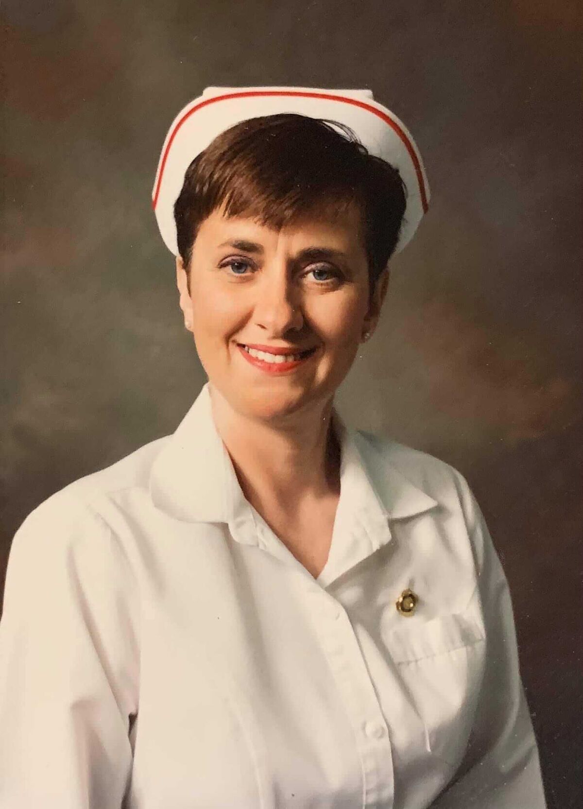 Pamela Caddell in her nurse's uniform.