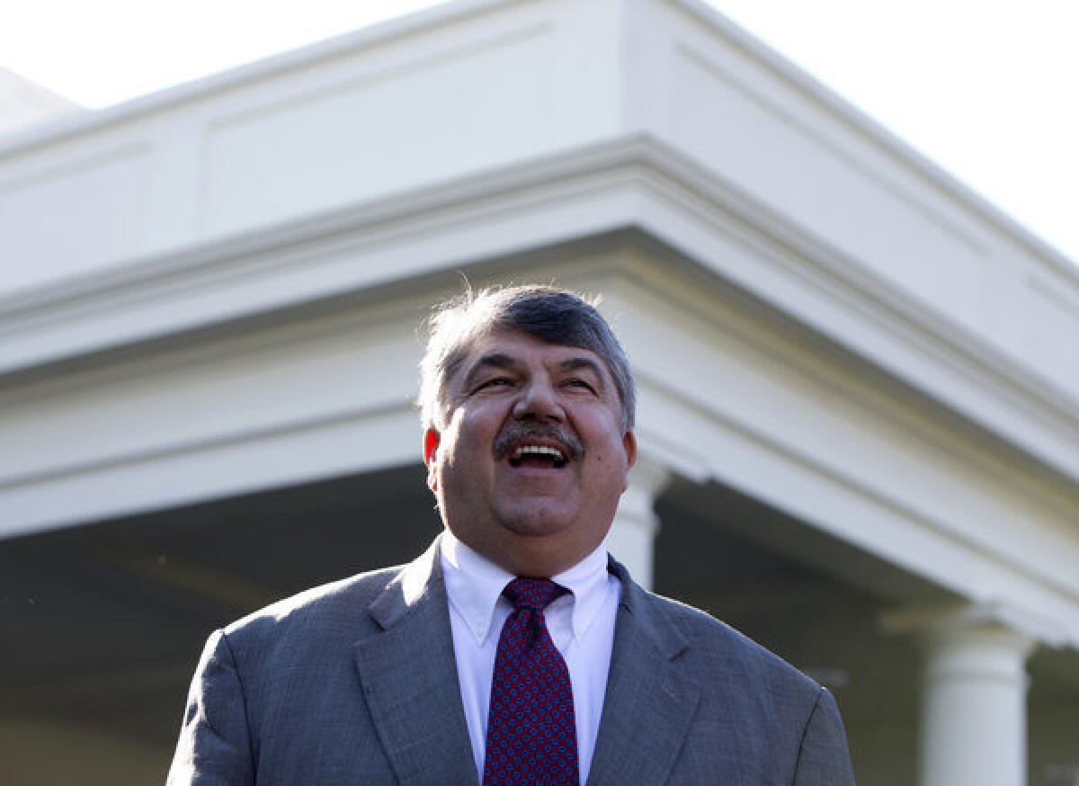 AFL-CIO President Richard Trumka speaks to reporters outside the White House after a meeting between labor and progressive leaders and President Obama.