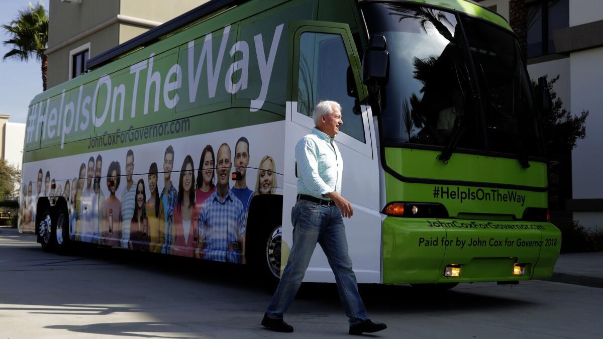 Cox walks past his bus at Huy Fong Foods, which makes the popular Sriracha Hot Chili Sauce.
