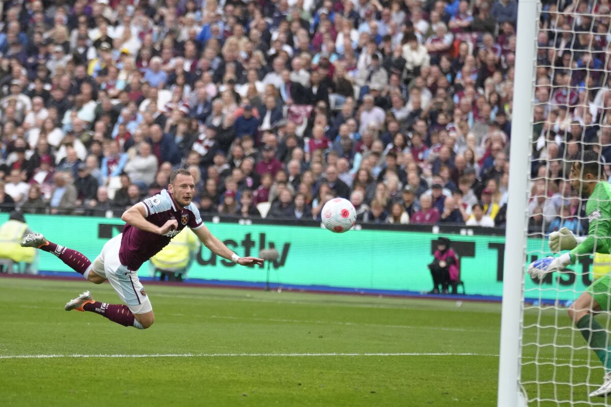 West Ham's Vladimir Coufal scores an own goal during the English Premier League soccer match between West Ham United and Manchester City at London stadium in London, Sunday, May 15, 2022. (AP Photo/Kirsty Wigglesworth)