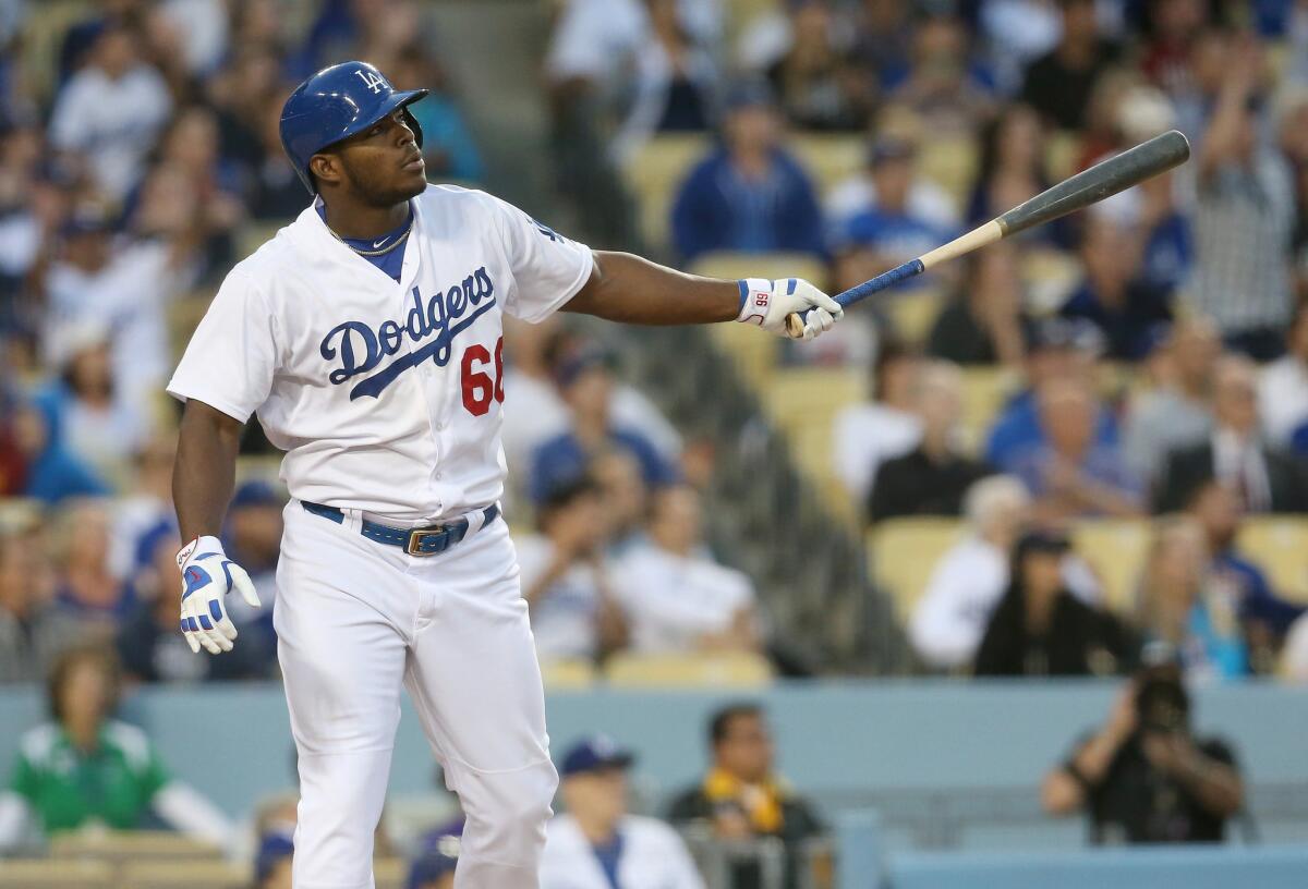 Dodgers outfielder Yasiel Puig watches his three-run homer in the second inning.