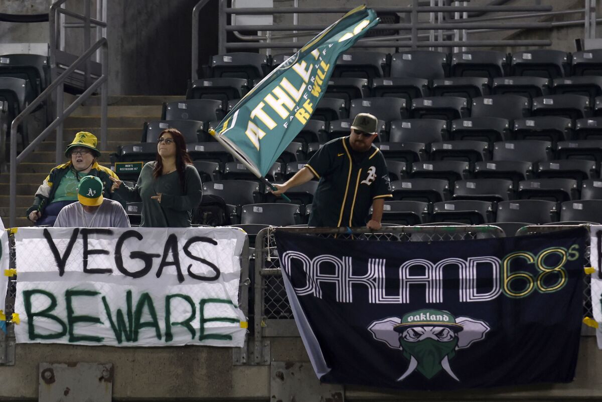 Fans watch a game between the Oakland Athletics and the Arizona Diamondbacks
