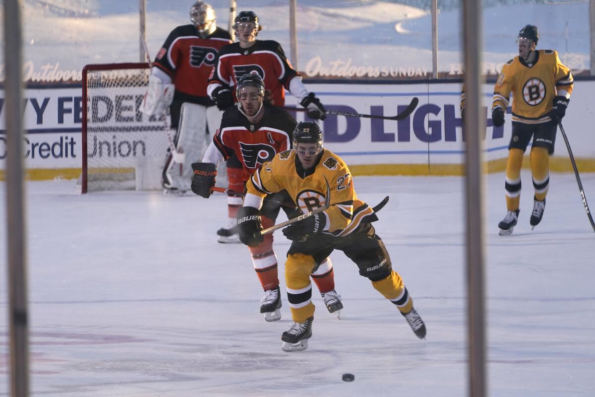 Photos: Bruins take on Flyers in NHL Outdoor Series at Lake Tahoe