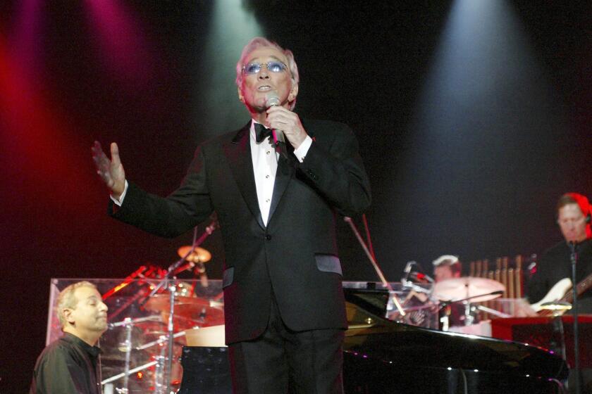 Andy Williams performs in 2004 in Bangkok, Thailand.