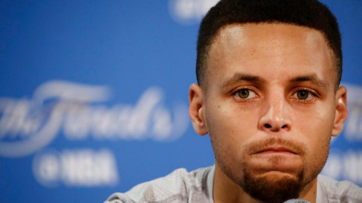 Warriors guard Stephen Curry looks on during a news conference on June 18 ahead of Game 7 of the NBA Finals.