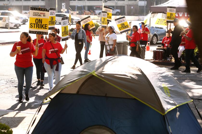 LOS ANGELES, CA - DECEMBER 6, 2023 - Hundreds of room attendants, cooks, dishwashers with Unite Here Local 11 occupy the Sheraton Gateway Los Angeles for the next 24 hours in Los Angeles on December 6, 2023. They set up several tents along the sidewalk of the hotel. The action will run day and night, as participants plan to camp on sidewalks overnight in order to demand wage increases that accommodate the skyrocketing cost of living in Los Angeles. Unite Here 11 members did the same at Four Points Sheraton by LAX.(Genaro Molina / Los Angeles Times)