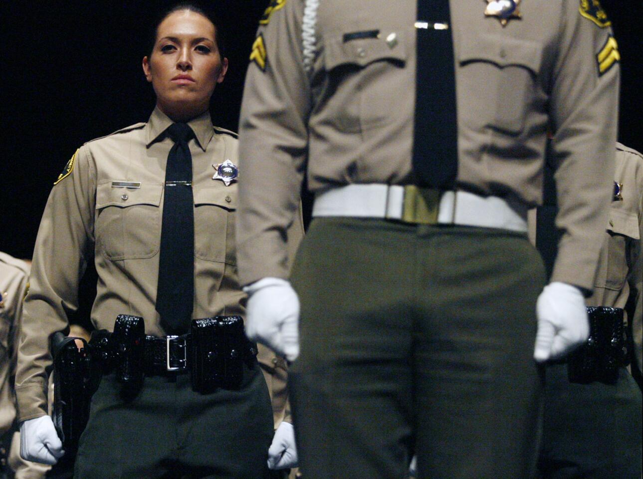 Burbank Police cadet Julie Oates attends her graduation ceremony, which took place at the Dorothy Chandler Pavilion in Los Angeles on Thursday, December 15, 2011.