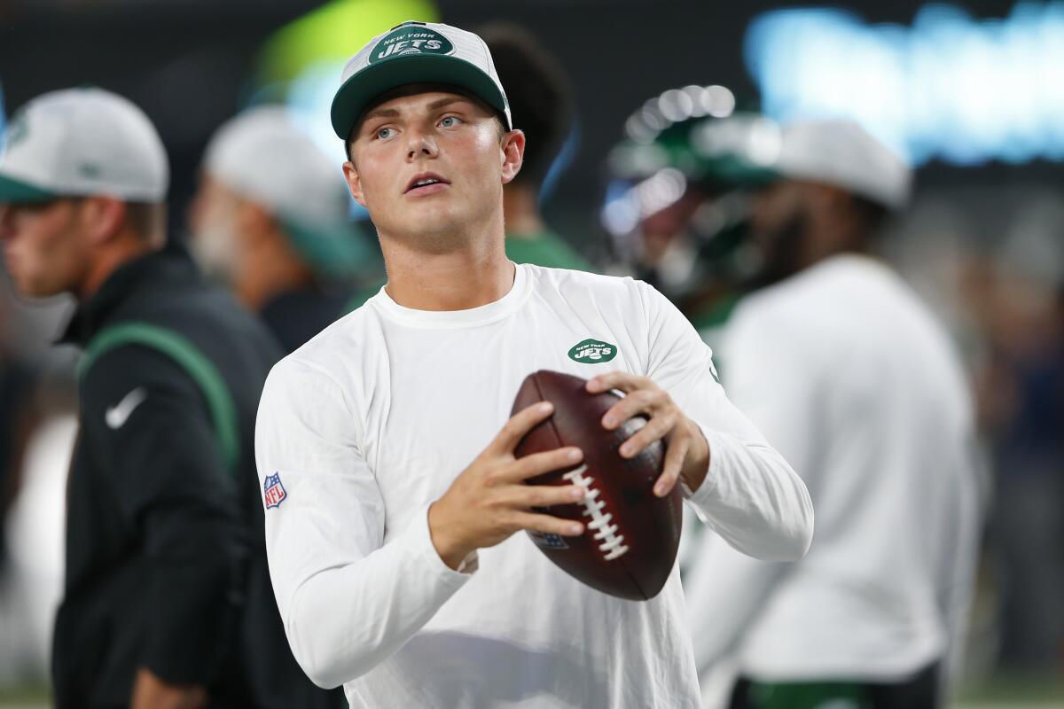 New York Jets quarterback Zach Wilson warms up before an NFL preseason football game against the Philadelphia Eagles Friday, Aug. 27, 2021, in East Rutherford, N.J. (AP Photo/Noah K. Murray)