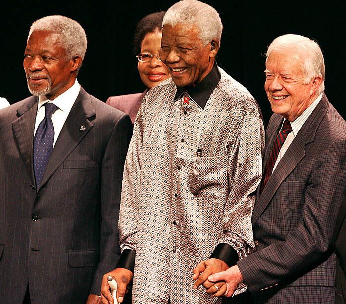 Nelson Mandela celebrates his 89th birthday flanked by former President Jimmy Carter, right, and former United Nations chief Kofi Annan, during the launching ceremony of the group known as the Elders -- a brain trust of elder statesmen -- on July 18, 2007.