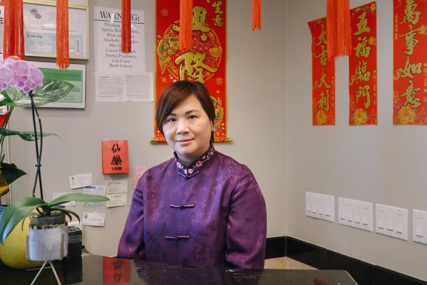 Monterery Park, CA - January 24: Restaurant owner Lina Situ stands at the front of her restaurant before a busy lunch shift at Taste of MP restaurant on Tuesday, Jan. 24, 2023 in Monterery Park, CA. Situ opened the restaurant a after years of working in the industry. (Dania Maxwell / Los Angeles Times).