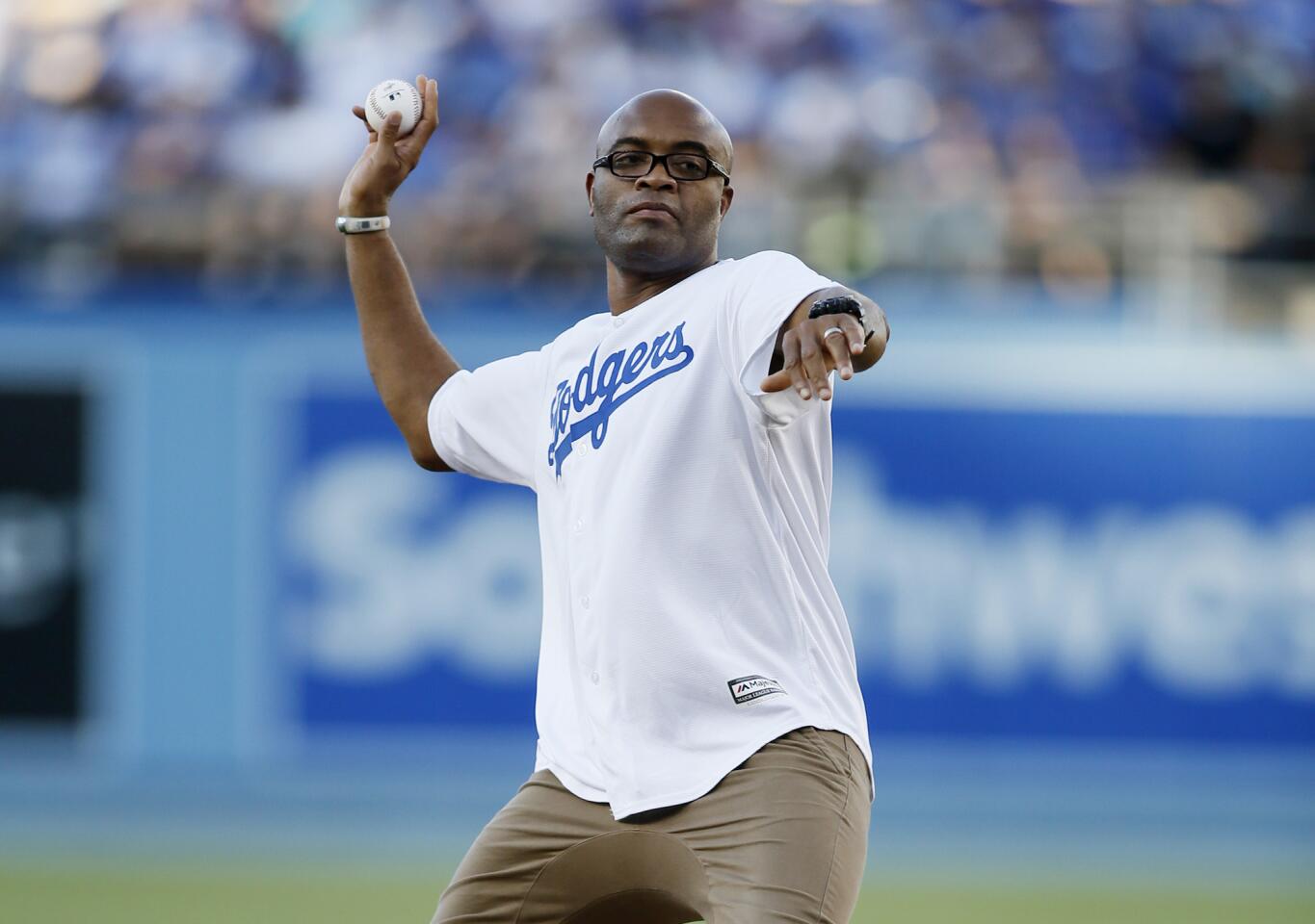 Mixed martial artist and former UFC fighter Anderson Silva throws out a ceremonial first pitch before the baseball game between the Los Angeles Dodgers and Milwaukee Brewers, Saturday, July 11, 2015, in Los Angeles. (AP Photo/Danny Moloshok)