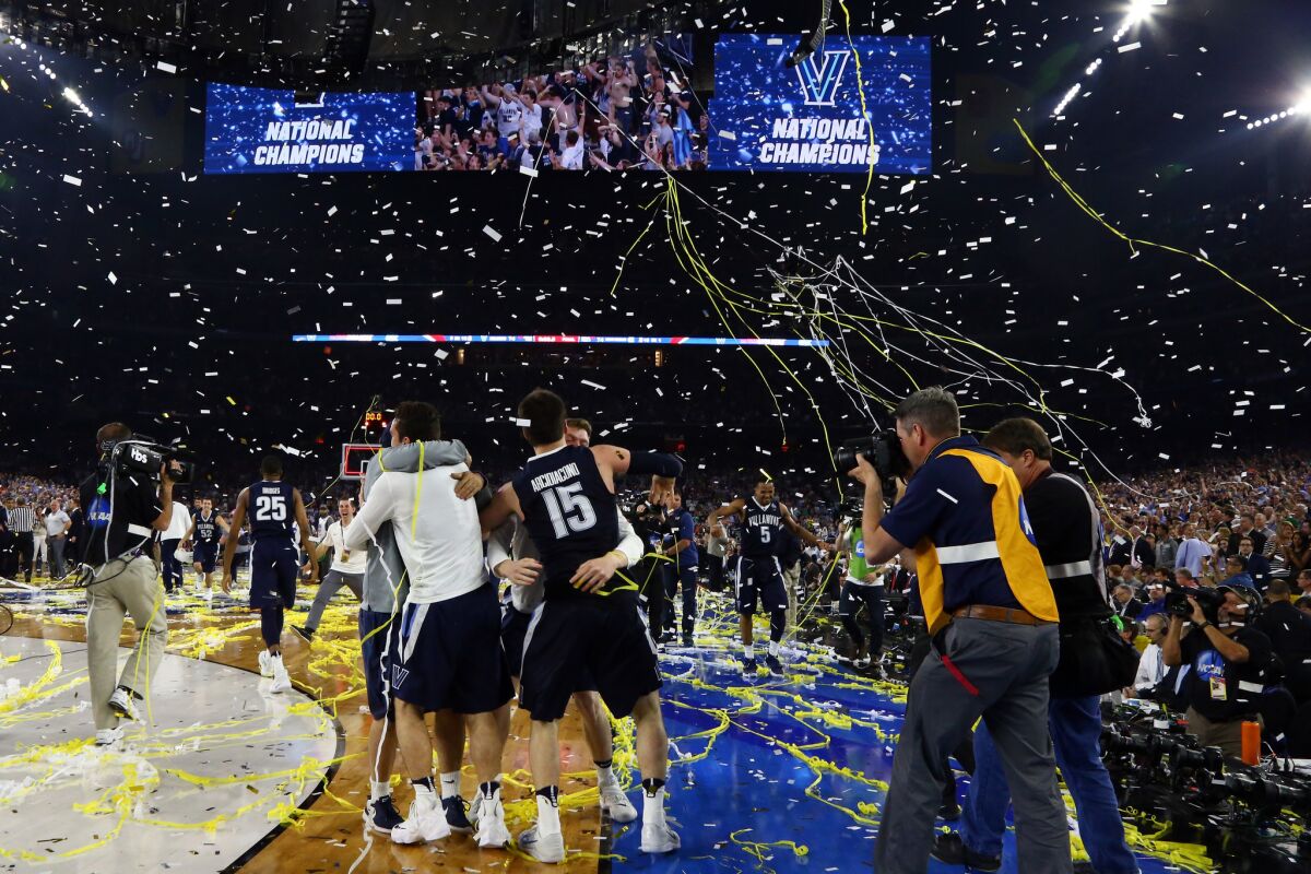 Villanova players celebrate after defeating North Carolina to win the NCAA championship game at NRG Stadium in Houston on April 4.