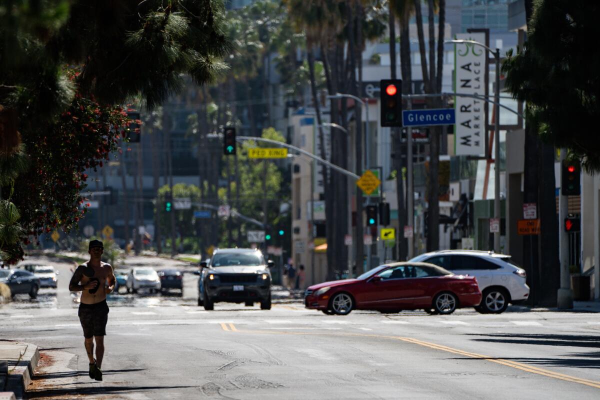 People along Maxella Avenue in Marina Del Rey in Los Angeles. 