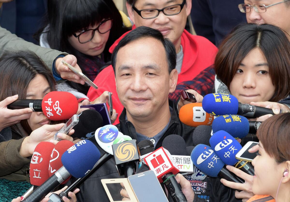 Eric Chu, mayor of New Taipei City, Taiwan, was chosen Saturday as leader of the country's Nationalist Party. Above, Chu speaks to journalists after voting in the party leadership election.