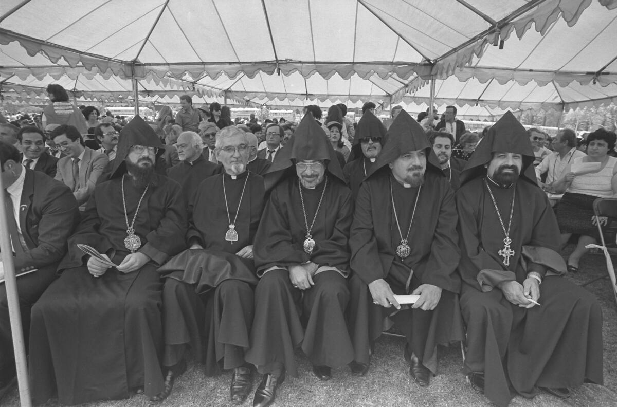 Clergymen join a crowd in Montebello Park in 1987