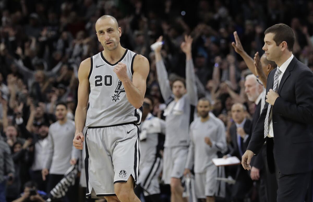 FILE - San Antonio Spurs guard Manu Ginobili (20) pumps his fist after hitting the winning shot in the final seconds of the team's NBA basketball game against the Boston Celtics, Friday, Dec. 8, 2017, in San Antonio. The four-time NBA champion with the San Antonio Spurs is one of the headliners for Saturday night’s enshrinement ceremony in Springfield, Massachusetts. (AP Photo/Eric Gay, File)