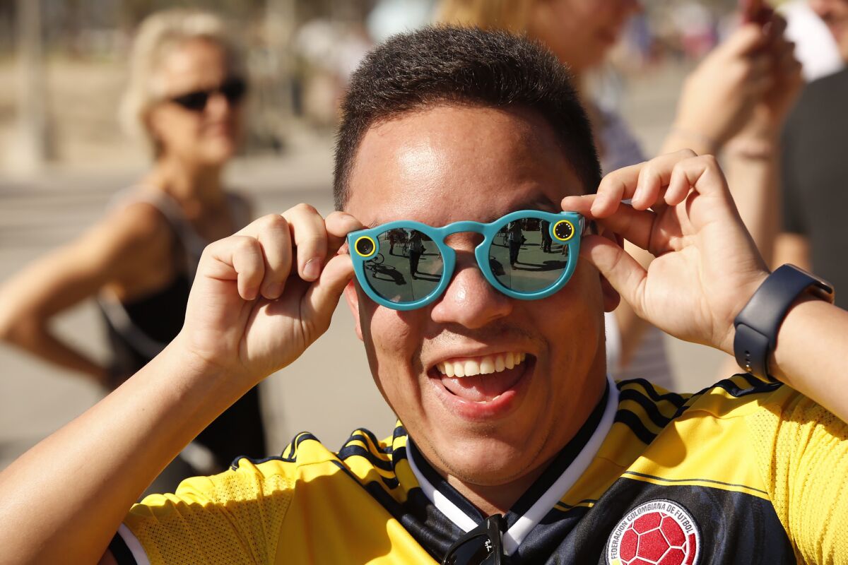 Albert Borrero, 32, tries his Snapchat Spectacles after being among the first to purchase them when they debuted last month.