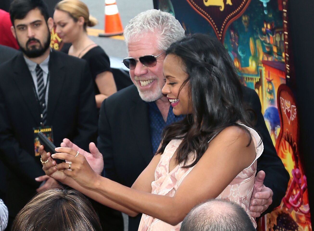 Actors Ron Perlman and Zoe Saldana pose at the premiere of Twentieth Century Fox and Reel FX Animation Studios' "The Book of Life" at Regal Cinemas L.A. Live on Oct. 12, 2014, in Los Angeles.