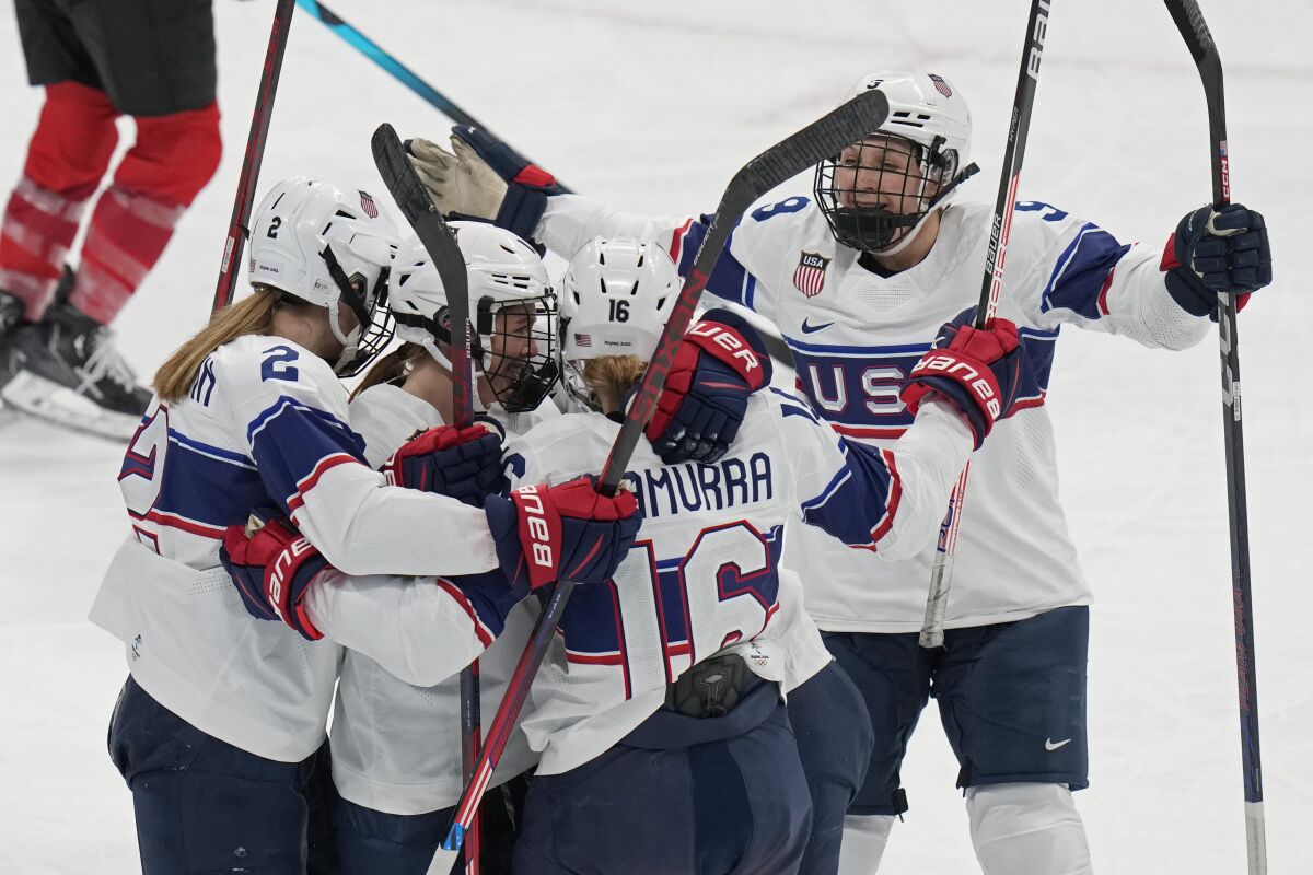 United States players celebrate a goal scored against Switzerland during a preliminary round women's hockey game at the 2022 Winter Olympics, Sunday, Feb. 6, 2022, in Beijing. (AP Photo/Petr David Josek)
