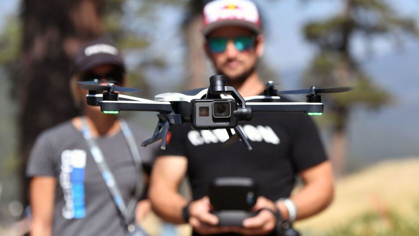 Darren Berreclota, right, pilots a GoPro Karma drone during a press event in Olympic Valley, Calif., on Sept. 19.