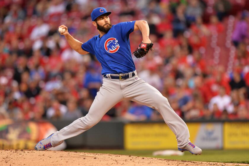 Chicago Cubs starter Jake Arrieta delivers a pitch against the Cincinnati Reds on April 21.