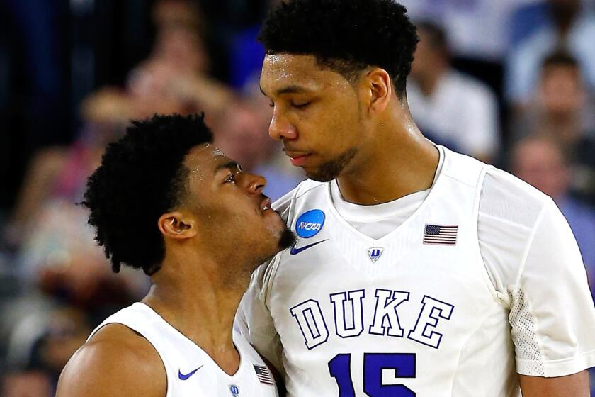 Duke guard Quinn Cook, left, and center Jahlil Okafor celebrate during the second half of an NCAA tournament game against Gonzaga on March 29.