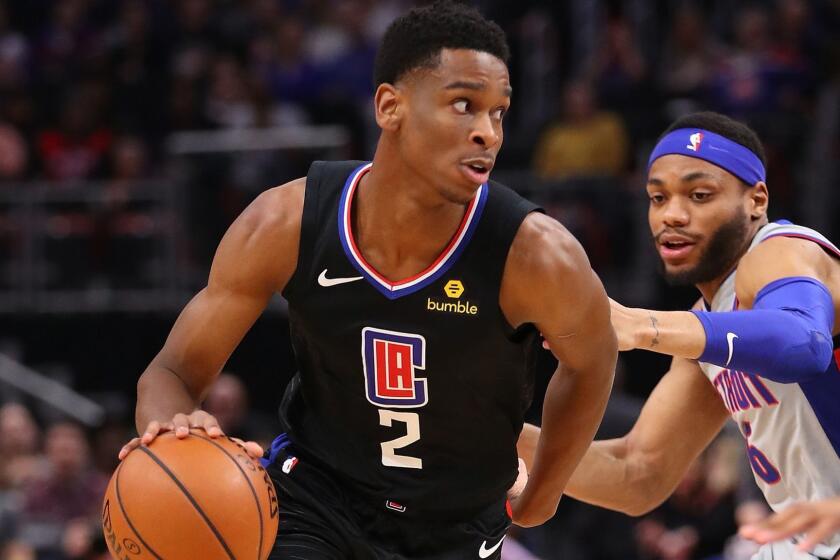 DETROIT, MICHIGAN - FEBRUARY 02: Shai Gilgeous-Alexander #2 of the LA Clippers drives around Bruce Brown #6 of the Detroit Pistons during the first half at Little Caesars Arena on February 02, 2019 in Detroit, Michigan. NOTE TO USER: User expressly acknowledges and agrees that, by downloading and or using this photograph, User is consenting to the terms and conditions of the Getty Images License Agreement. (Photo by Gregory Shamus/Getty Images) ** OUTS - ELSENT, FPG, CM - OUTS * NM, PH, VA if sourced by CT, LA or MoD **