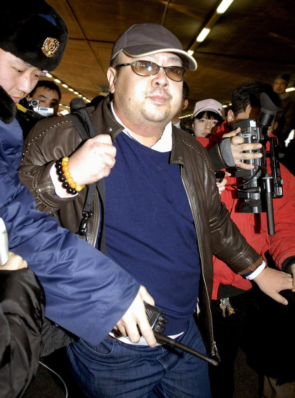 A man believed to be North Korean leader Kim Jong Un's brother, Kim Jong Nam, walks among journalists upon his arrival at the Beijing airport on Feb. 11, 2007.