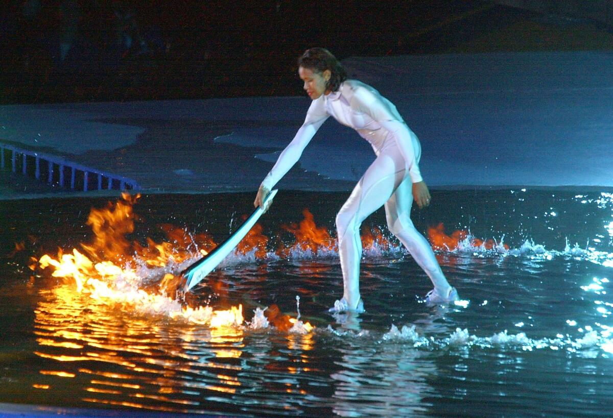 Australian sports icon Cathy Freeman lights the Olympic cauldron in Sydney in 2000.