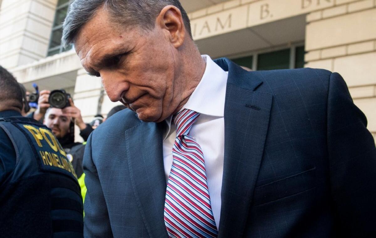 Michael Flynn leaves after the delay in his sentencing hearing at U.S. District Court in Washington.