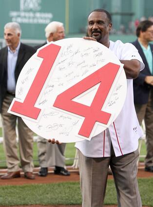 Jim Rice holds up retired number