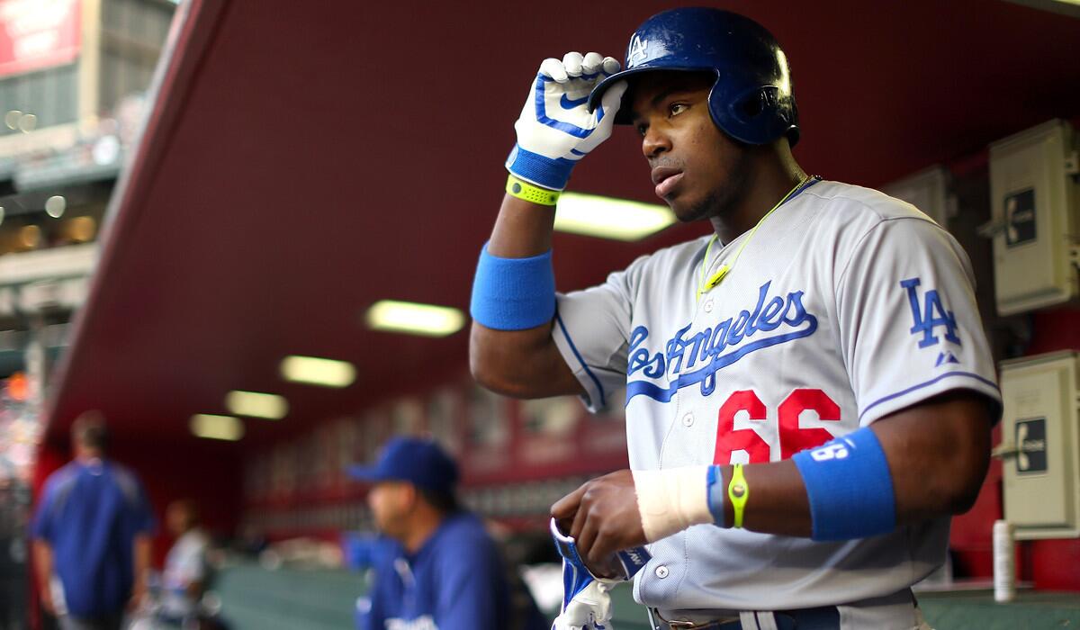 Dodgers right fielder Yasiel Puig prepares to bat against the Diamondbacks during a 7-1 victory on Friday night in Phoenix.