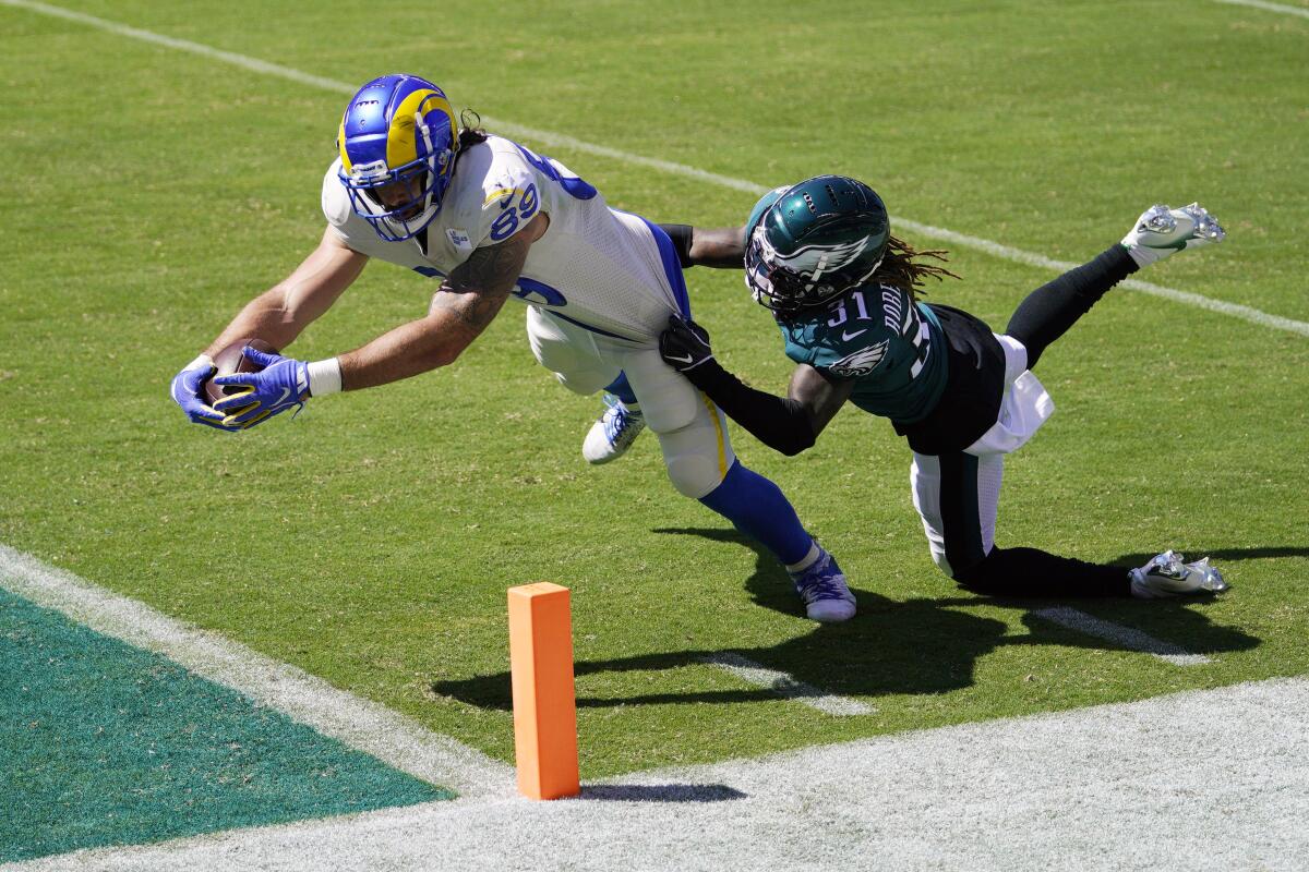 The Rams' Tyler Higbee reaches for a touchdown against the Philadelphia Eagles' Nickell Robey-Coleman.