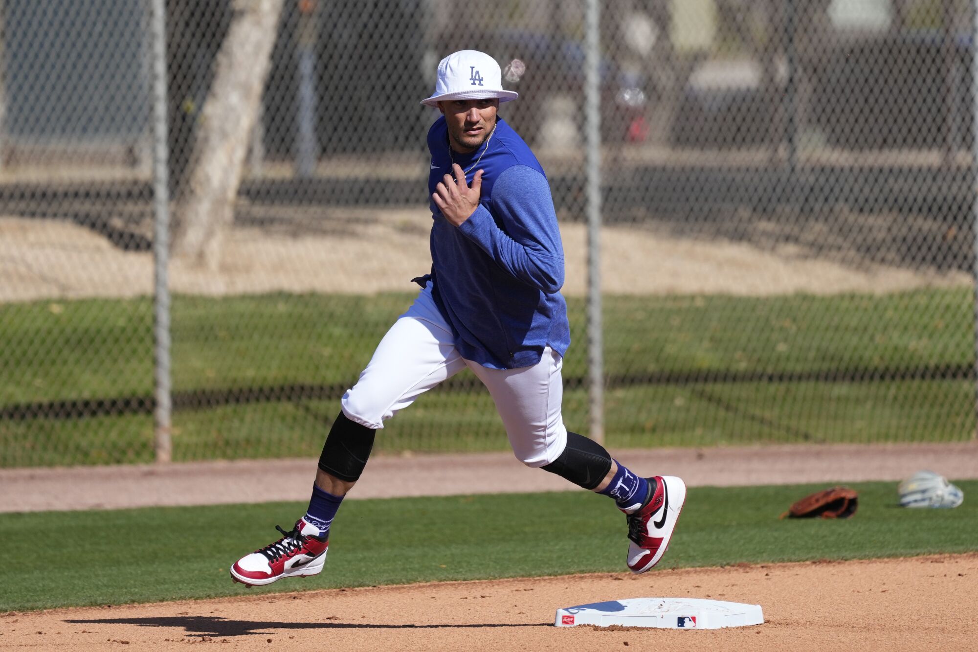 Miguel Rojas runs the bases during the first day of spring training.