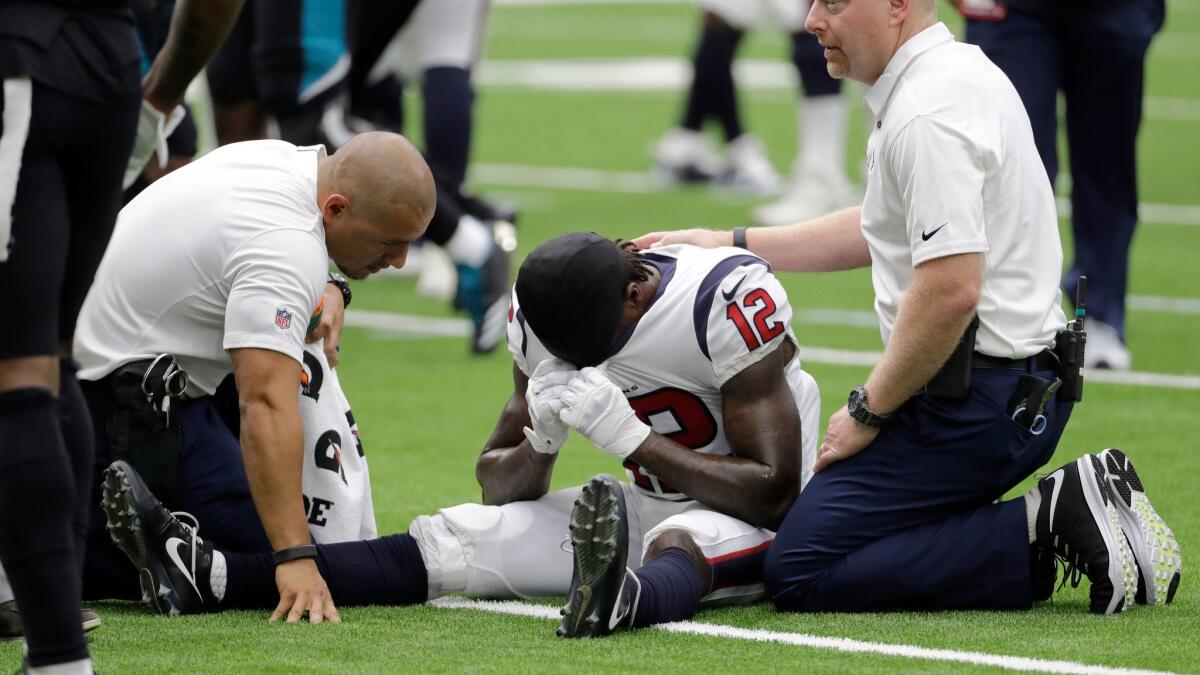 Houston Texans wide receiver Bruce Ellington is treated after an injury during the second half in Houston.