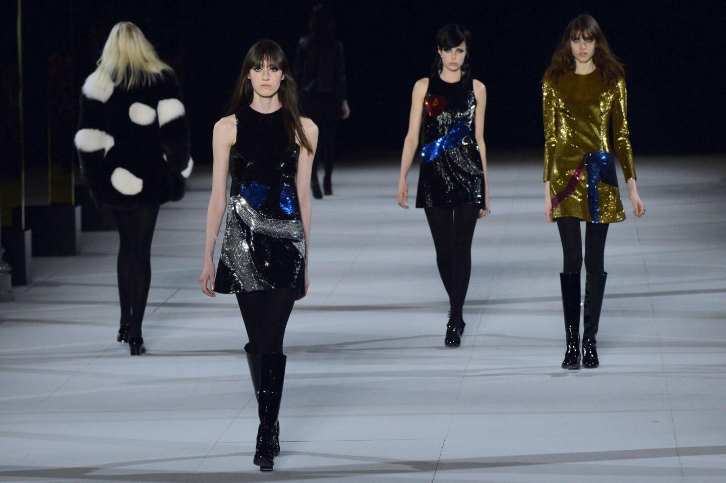 Three limited-editon mini-dresses, from right, from Saint Laurent designer Hedi Slimane were made in collaboration with L.A. artist John Baldessari.