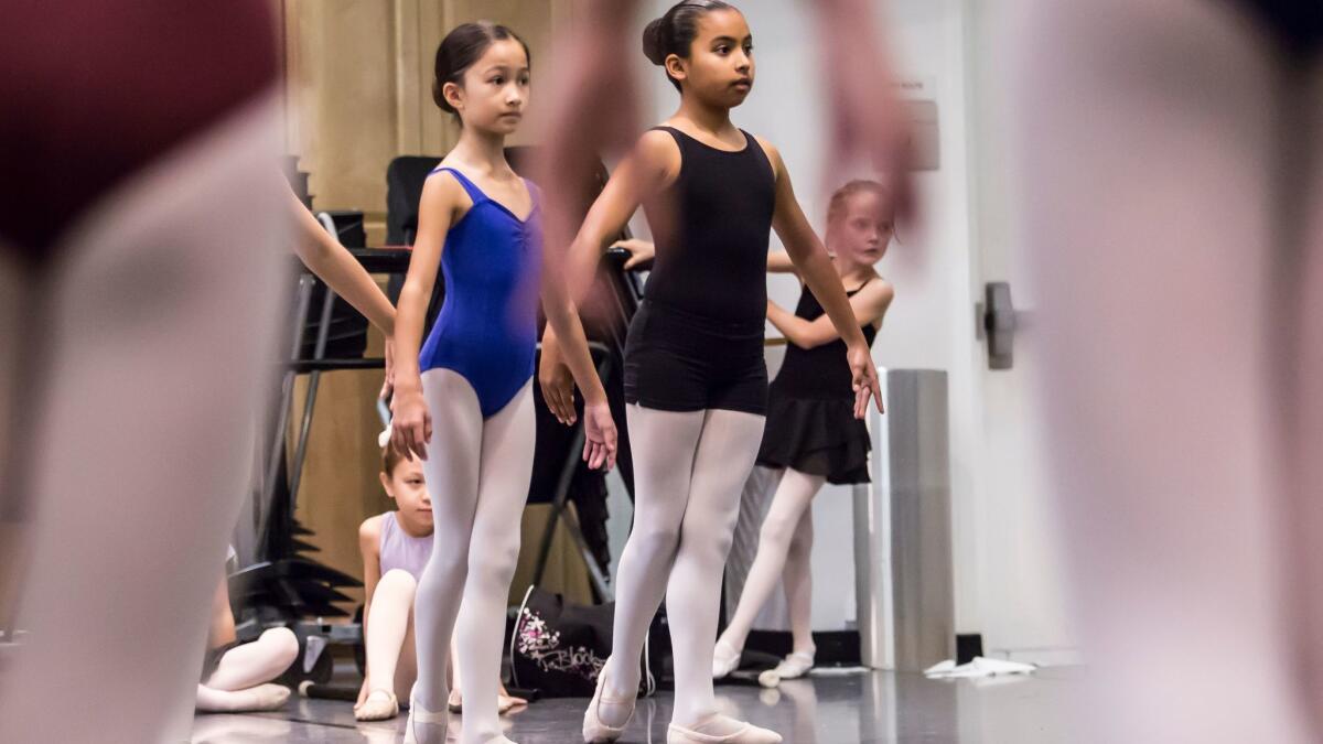 Ten-year-old Emily Gonzalez, at center wearing black, rehearses for the Music Center-Miami City Ballet production of "The Nutcracker," which starts Thursday.