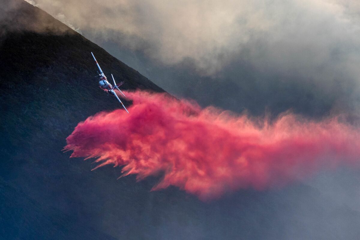 An air tanker makes a drop on the Colorado fire