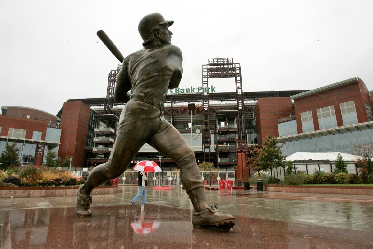 A statue of Philadelphia Phillies Hall of Fame third baseman Mike Schmidt stands outside Citizens Bank Park in Philadelphia.