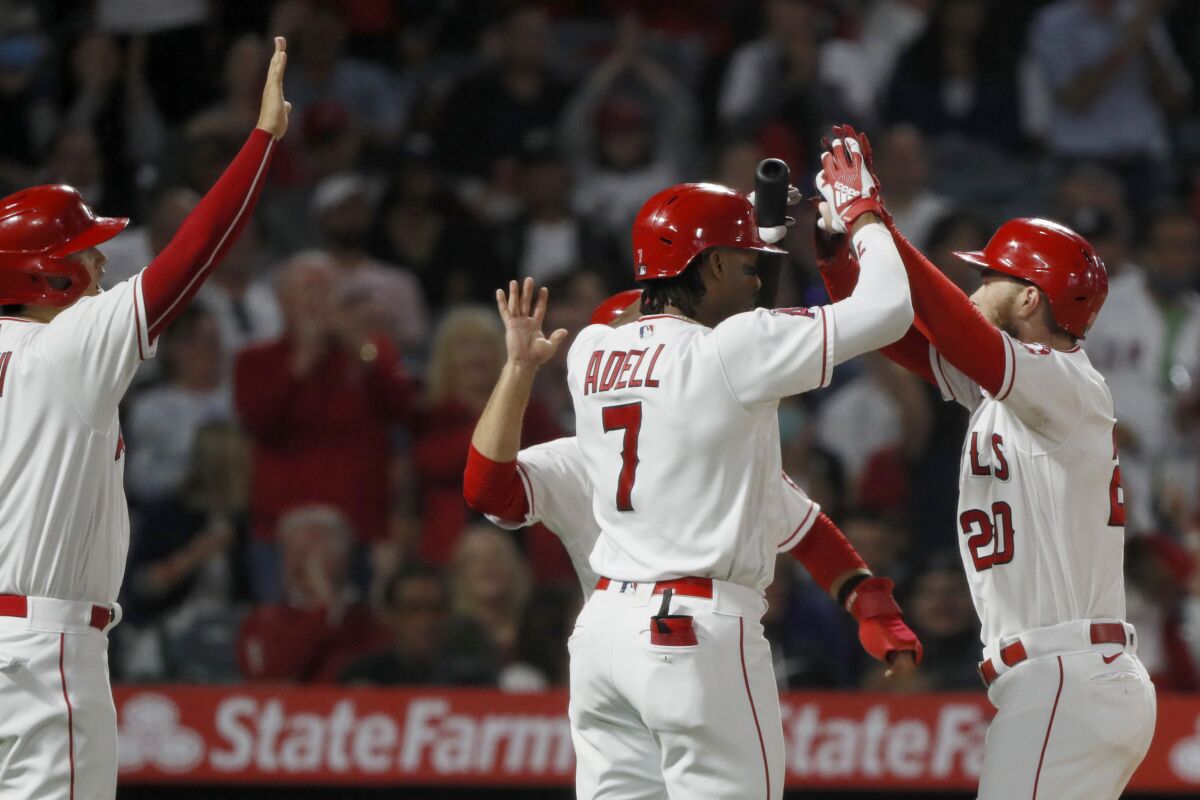 The Angels celebrate Jared Walsh's three-run homer.