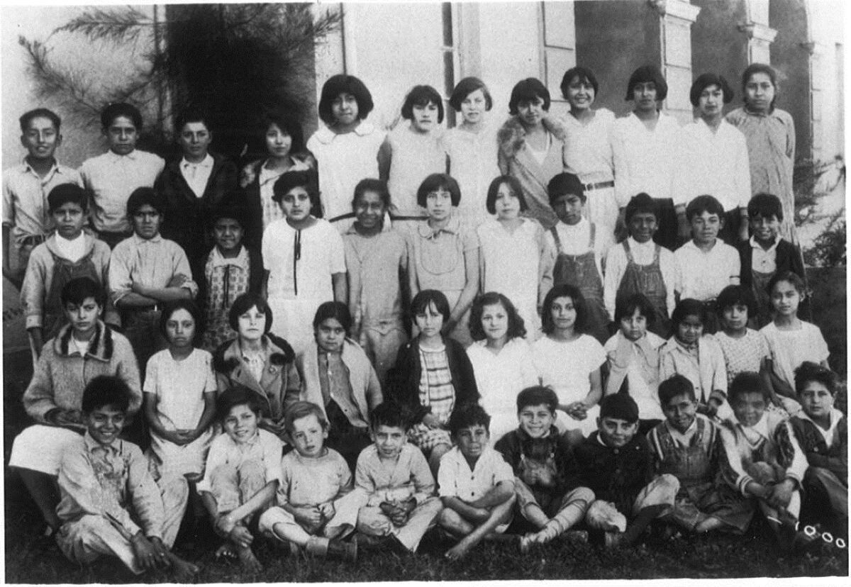 A class photo from around 1928 at Lemon Grove Elementary shows Robert Alvarez in the third row at left next to the teacher.
