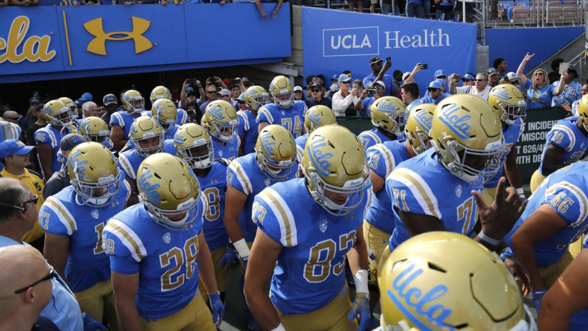 The UCLA Bruins take the field for their game against USC at the Rose Bowl on Nov. 17.