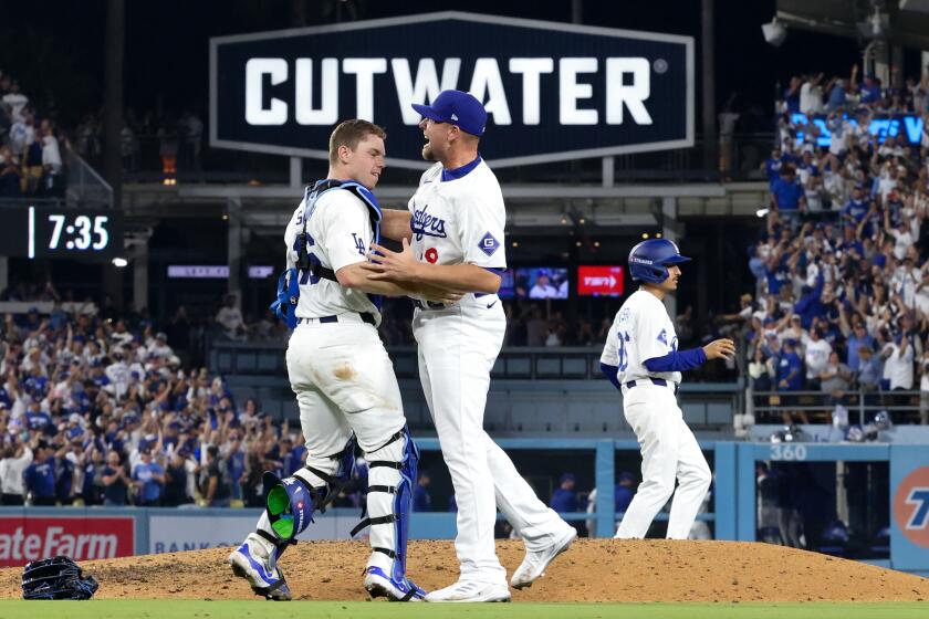 LOS ANGELES, CALIFORNIA - OCTOBER 11: Blake Treinen #49 of the Los Angeles Dodgers celebrates.