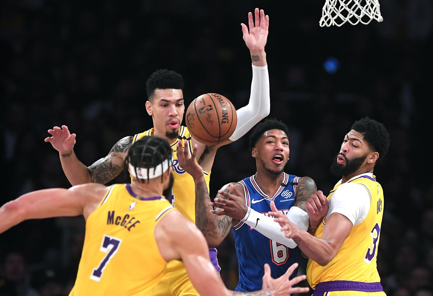 Knicks guard Elfrid Payton loses the ball in front of Lakers Javale McGee, Danny Green and Anthony Davis during the first quarter of a game Jan. 7 at Staples Center.