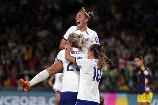 England's Alessia Russo , center, is celebrated after she scored her side's second goal.