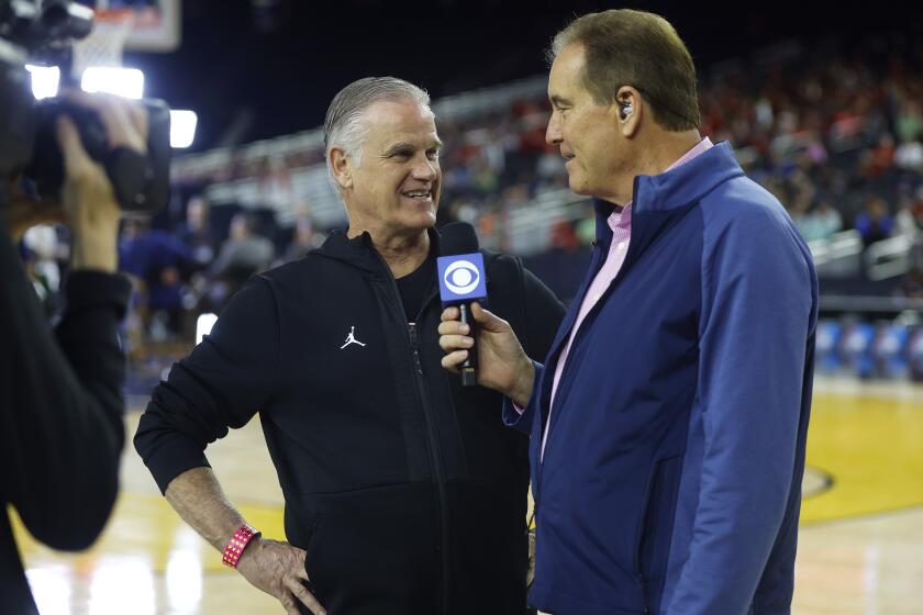 Houston, TX - March 31: San Diego State coach Brian Dutcher talks with CBS announcer Jim Nantz during a practice for a Final Four game in the NCAA Tournament on Friday, March 31, 2023 in Houston, TX. (K.C. Alfred / The San Diego Union-Tribune)