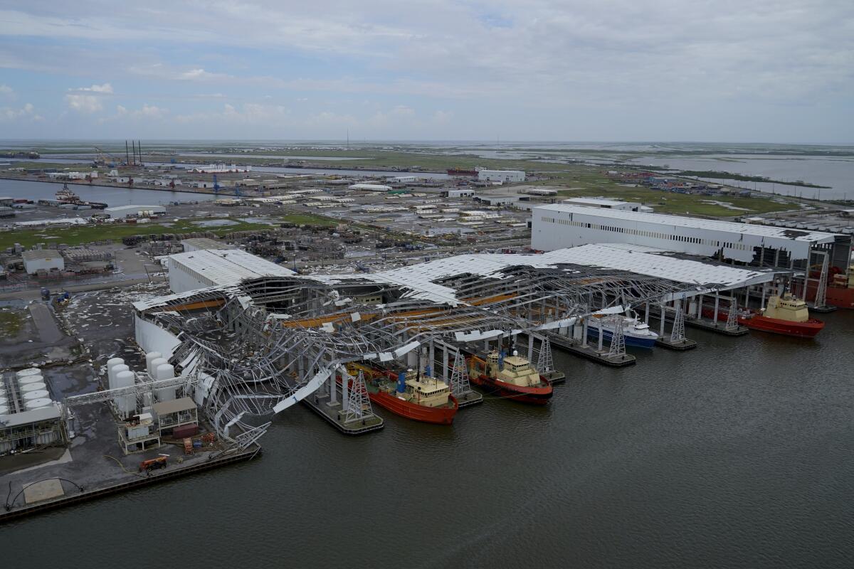 Damage to ship docking facilities are seen in the aftermath of Hurricane Ida in Port Fourchon, La., Tuesday, Aug. 31, 2021. (AP Photo/Gerald Herbert)