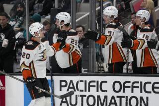 Anaheim Ducks right wing Brett Leason (20) is congratulated for his goal against the San Jose Sharks during the first period of an NHL hockey game Thursday, Feb. 29, 2024, in San Jose, Calif. (AP Photo/Godofredo A. Vásquez)