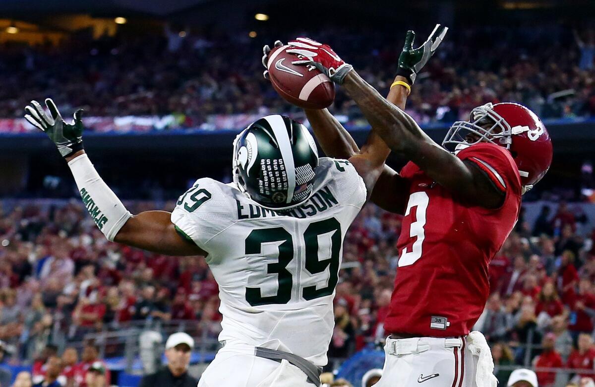 Alabama's Calvin Ridley makes a catch over Michigan State's Jermaine Edmondson during the Cotton Bowl on Dec. 31 -- a Thursday.